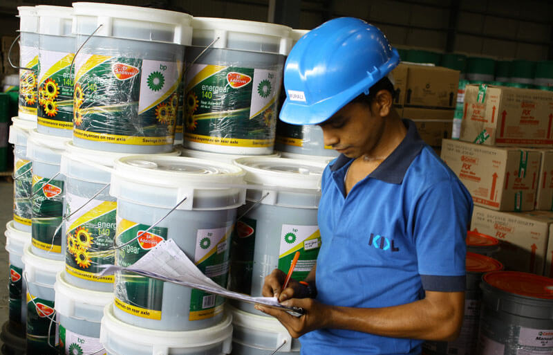 Worker doing stock checking in warehouse