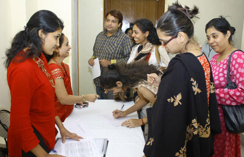 Registration desk with visitors registering for an event