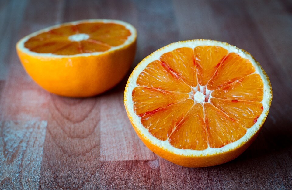 Two pieces of orange on a table