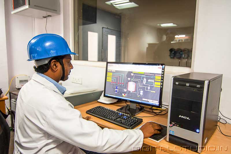 Worker in a Control room of a pharma plant