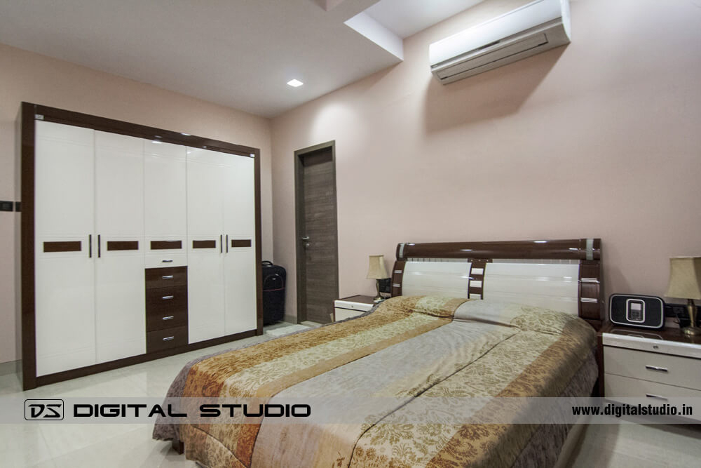 Master bedroom with double bed and wall unit