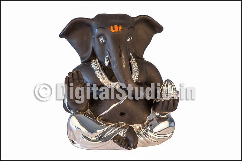 Silver and black Ganesha in sitting pose