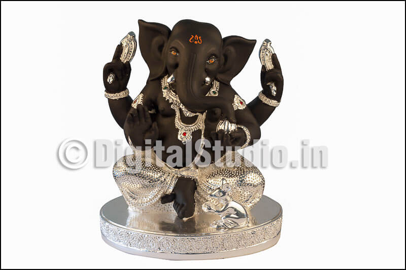 Silver and black Ganesha in sitting pose