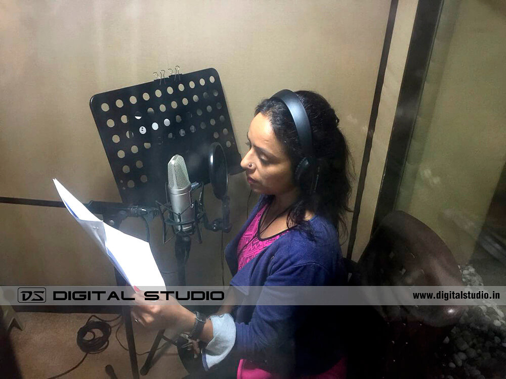 Female voice over artist recording a script