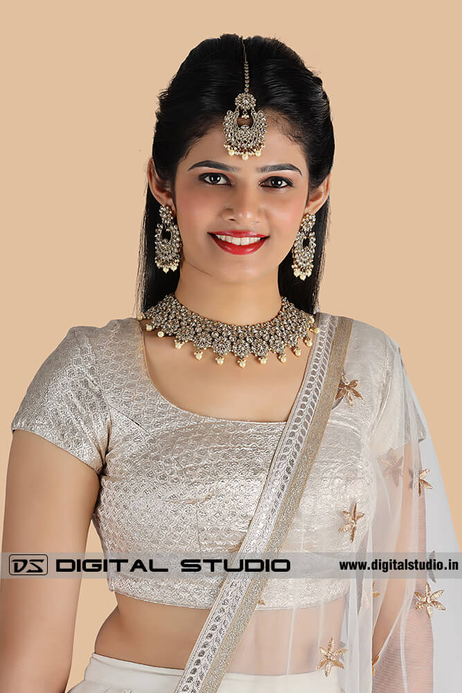 front photograph of model with heavy Indian jewellery