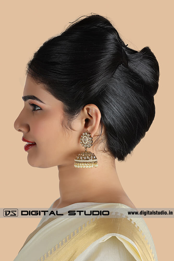 Profile photograph of model with jewellery