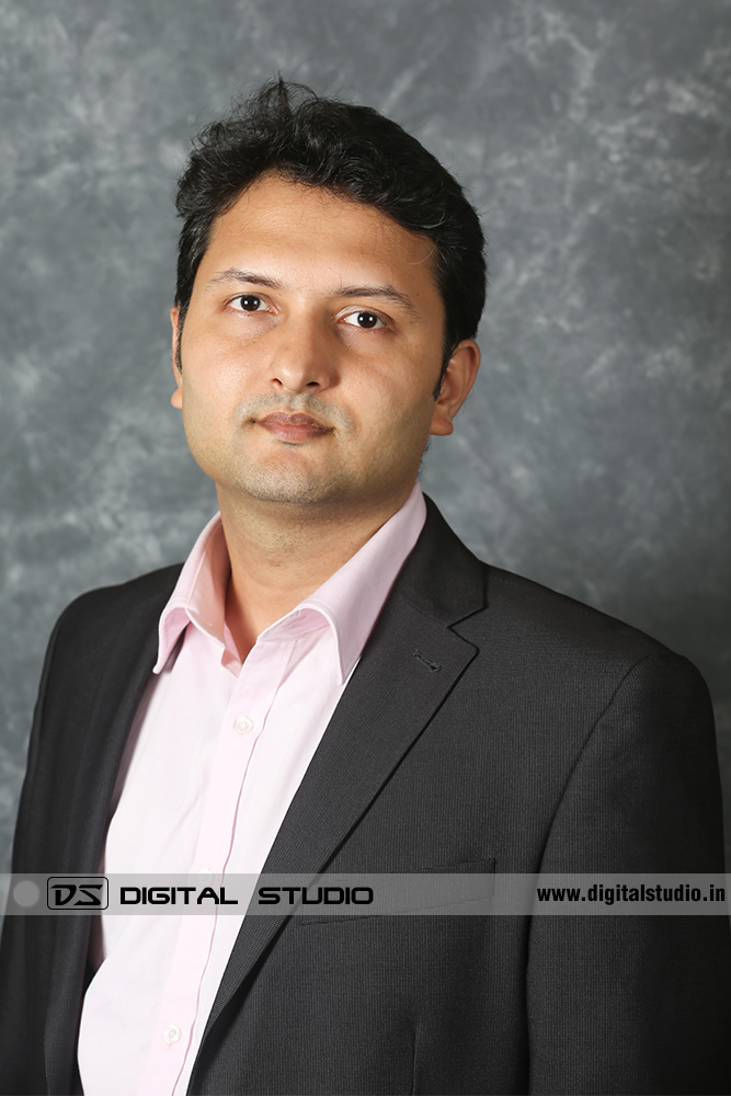 Profile photograph of a smiling MD wearing a black blazer