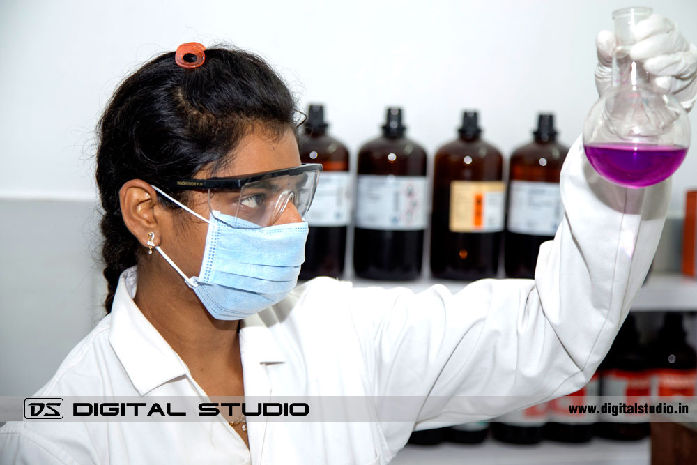 Woman lab technician working with solvents