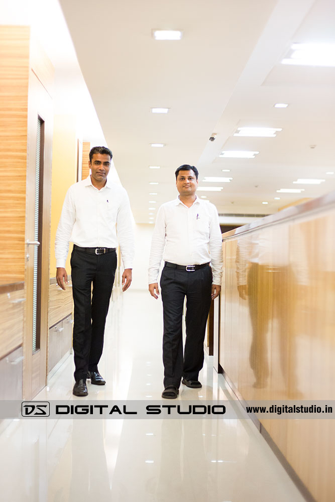 Two executives walking in corporate office
