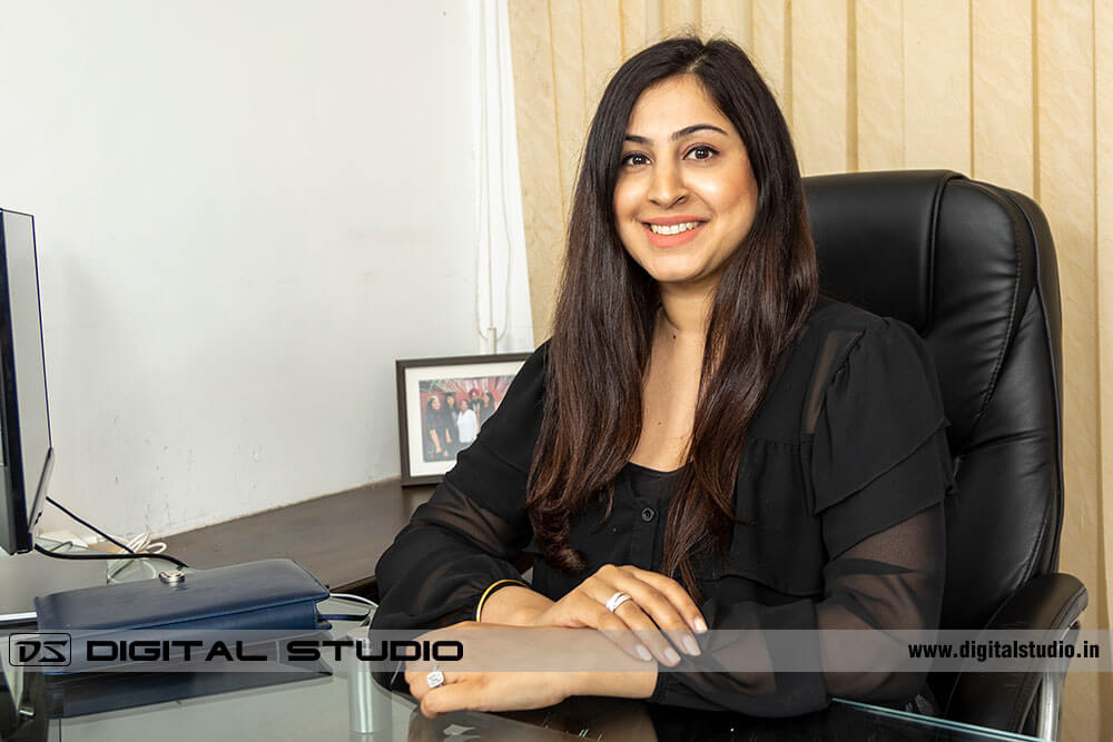 Director posing on office desk