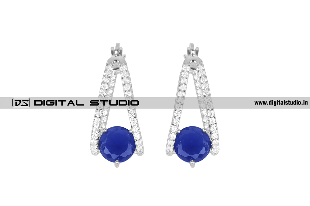 Dangling silver earrings with blue stone