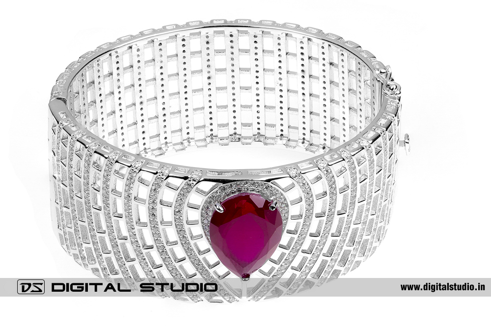 Heart shaped red ruby in silver bangle