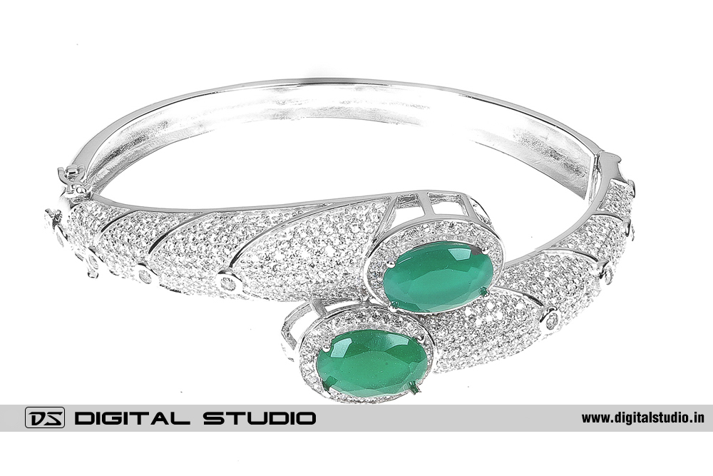 Pure silver bangle with green stones