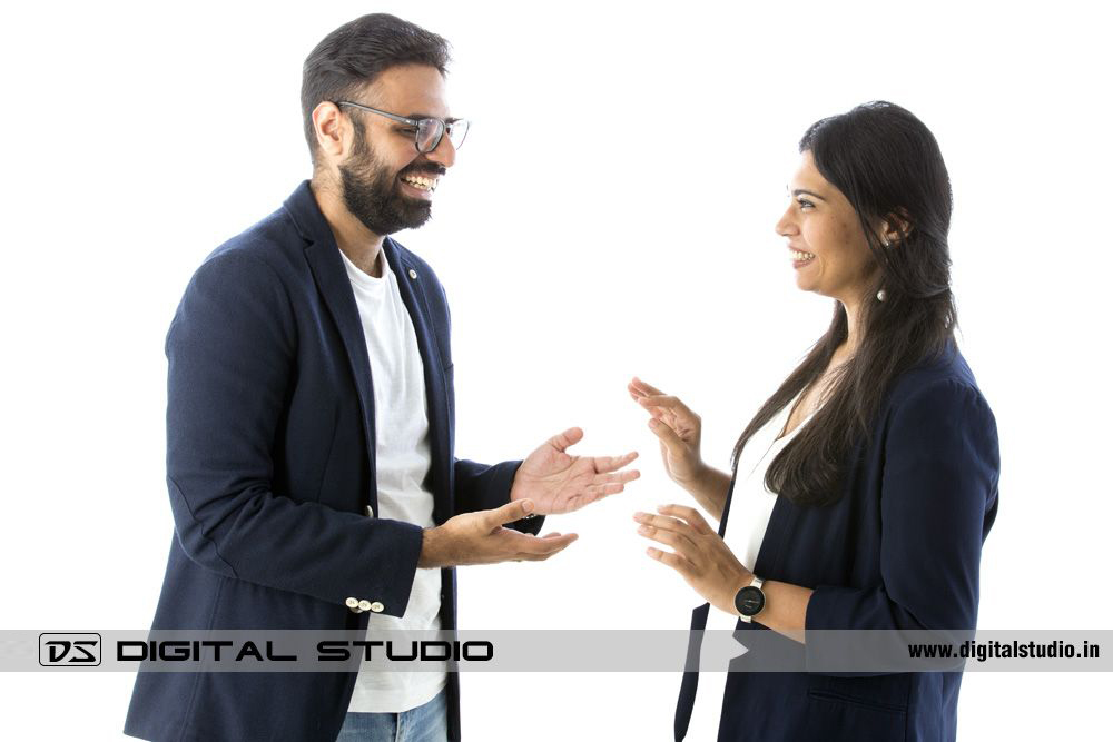 Laughing and smiling couple on white background