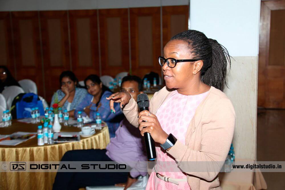 A lady professor talking with audience during the seminar