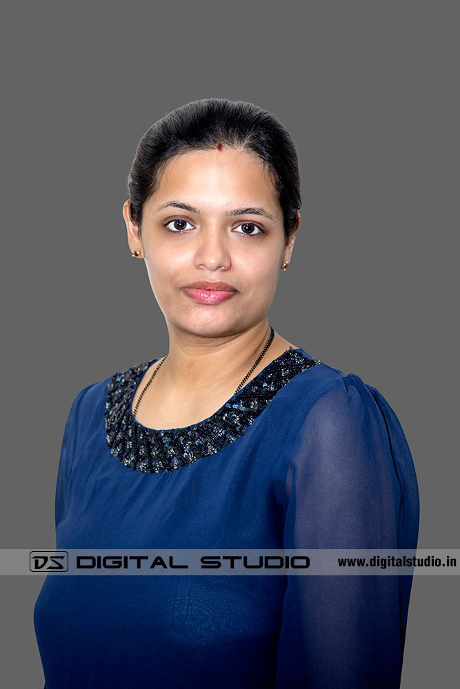 Corporate headshot of lady in blue dress