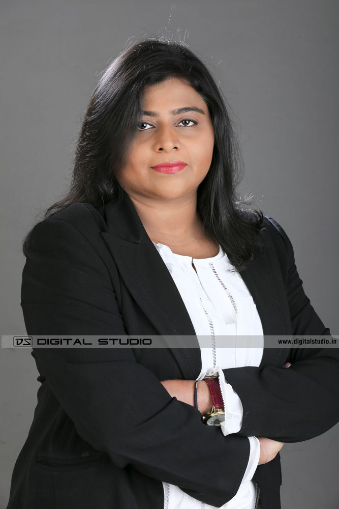 Lady corporate headshot on grey backdrop