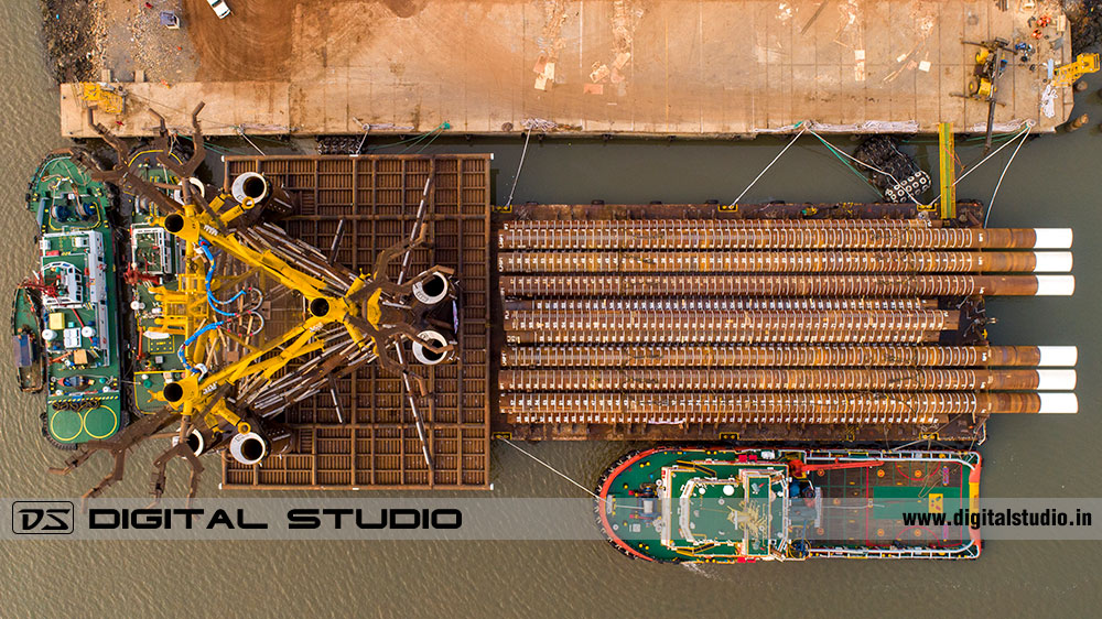 Top down photo of a barge with large machine