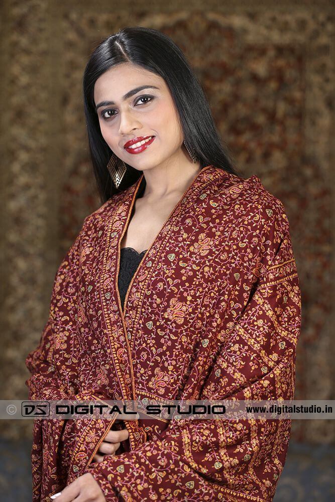 Model wearing embroidered pashmina shawl