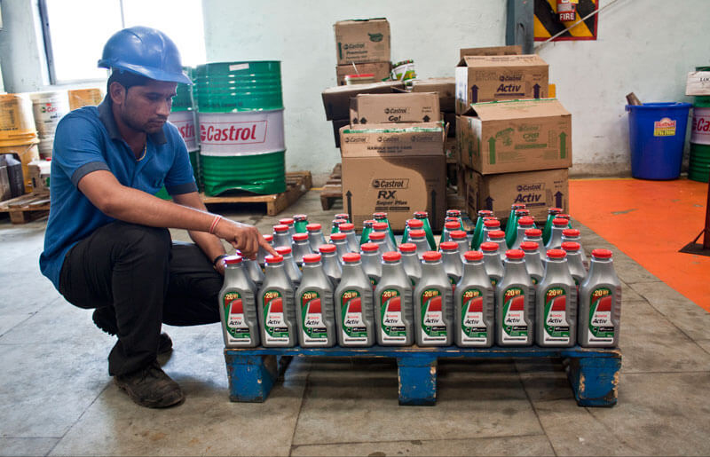 Worker doing physical stock checking in warehouse