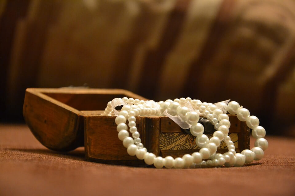 Pearls necklace on wooden box