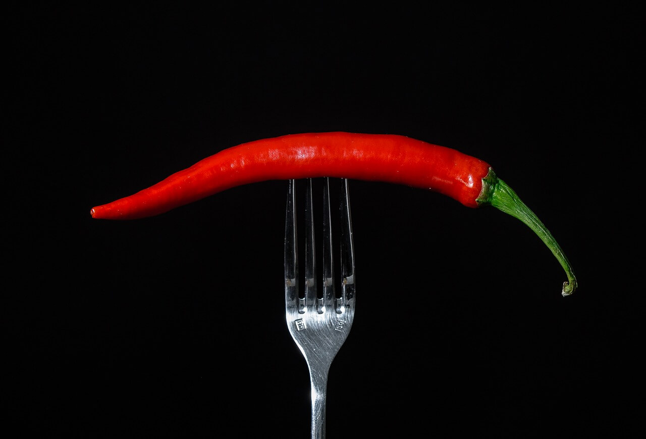 Innovative presentation of red chilli on a fork 