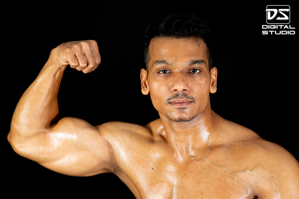single arm front pose of fitness model