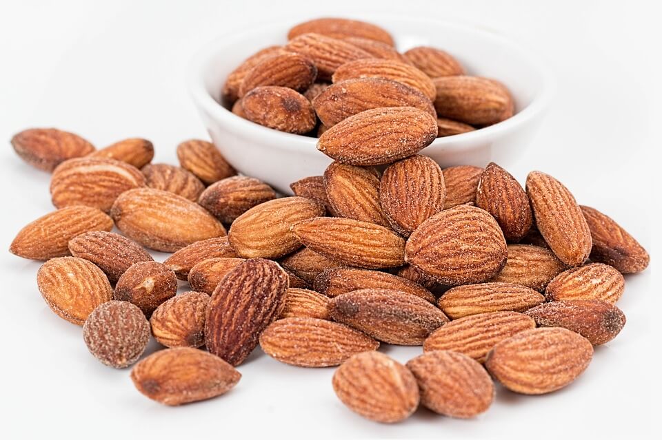 Macro photograph of roasted and salted almonds