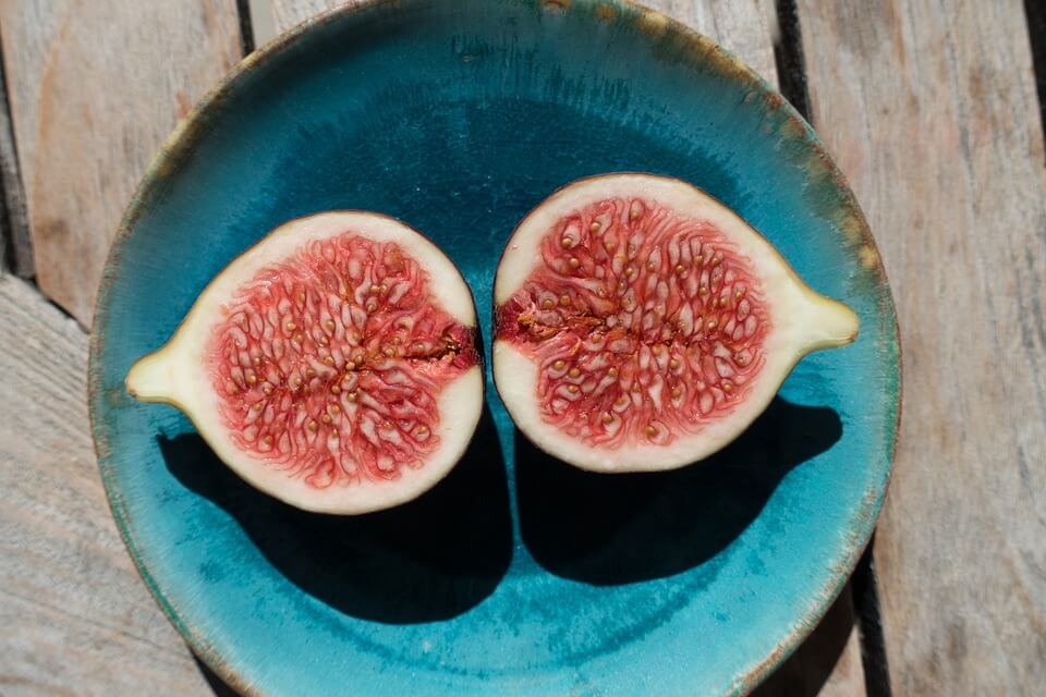 Two pieces of fig in a plate