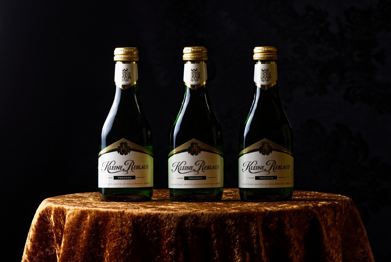 Lifestyle photograph of three wine bottles