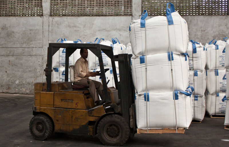 Man with a fork lift in warehouse