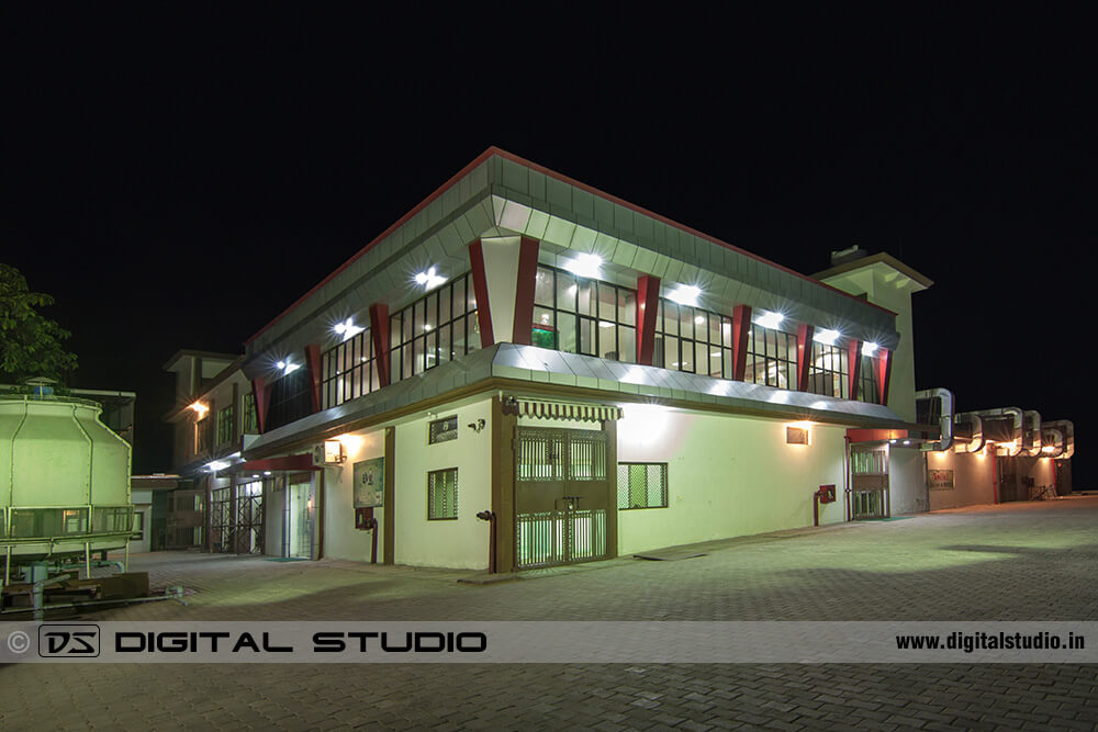 Exterior night photograph of factory