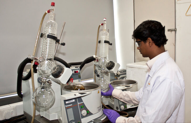 Technician working in a quality control of a pharma plant
