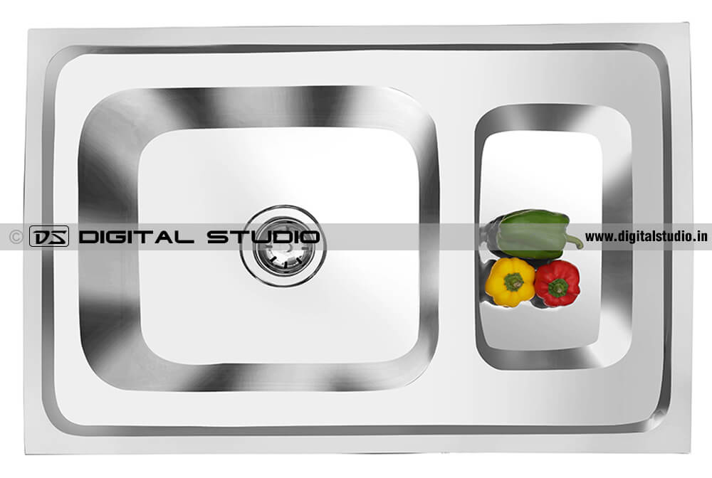 Stainless steel finishing photo of kitchen sink with bell peppers