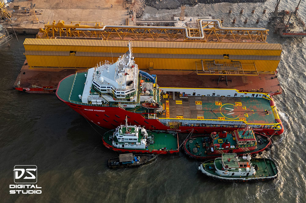 Tug boats and loaded barge, ready for sail off