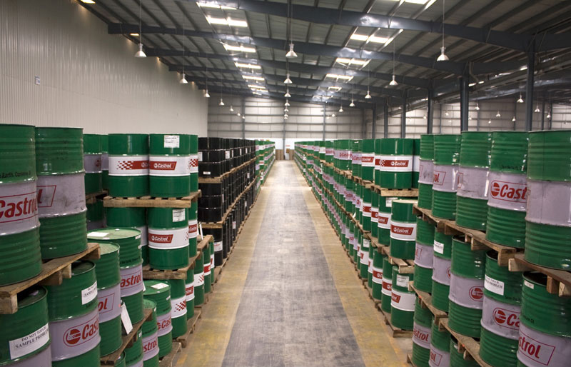 wide angle photograph oil drums warehouse