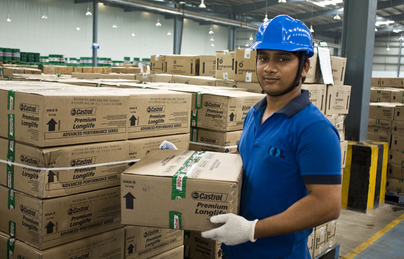 Worker in a warehouse with gloves