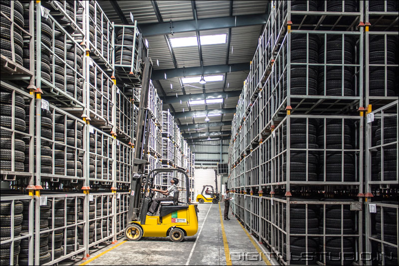 Forklift operator placing goods in a warehouse