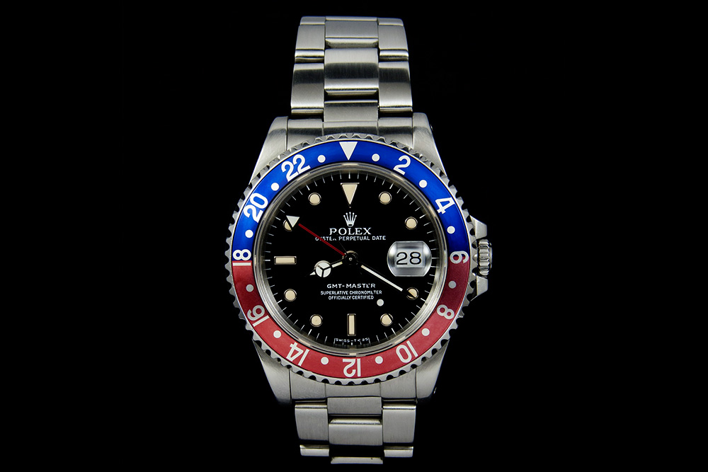 Rolex on black background