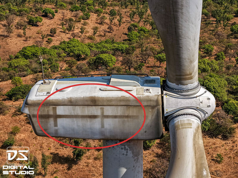 Wind turbine nacelle housing showing surface contamination and environmental staining detected during drone inspection
