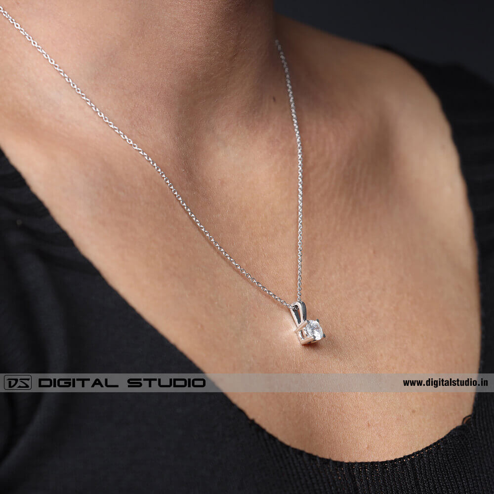 Model wearing diamond pendant