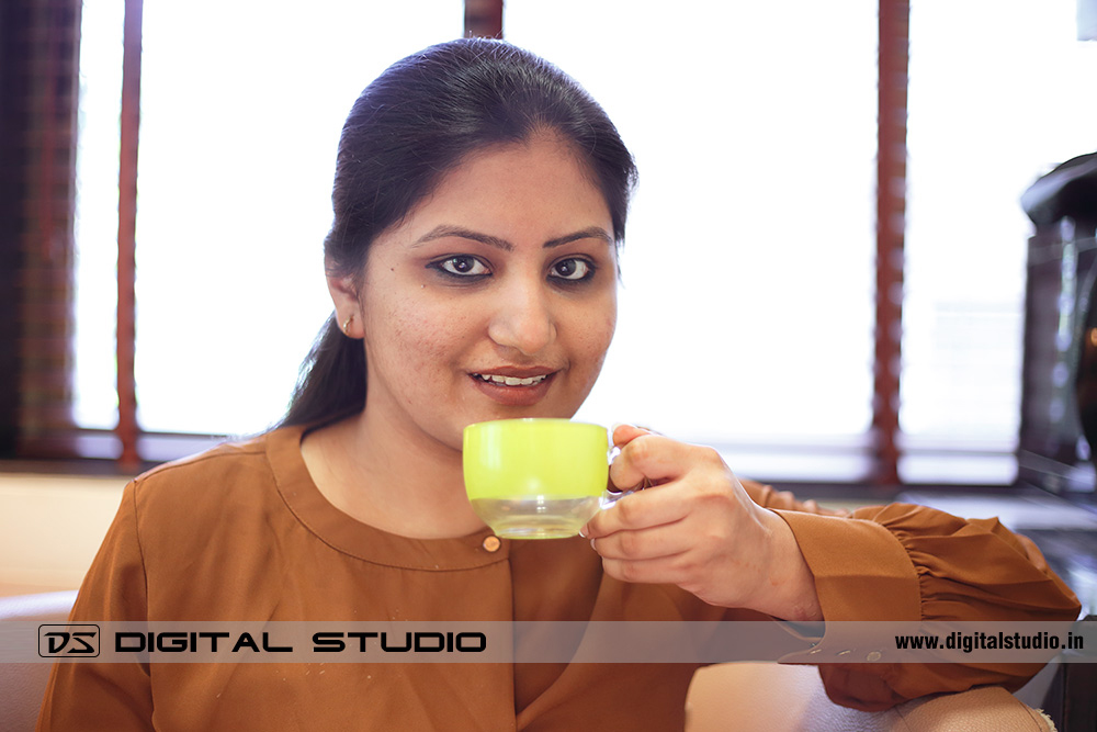 Lady in office having coffee