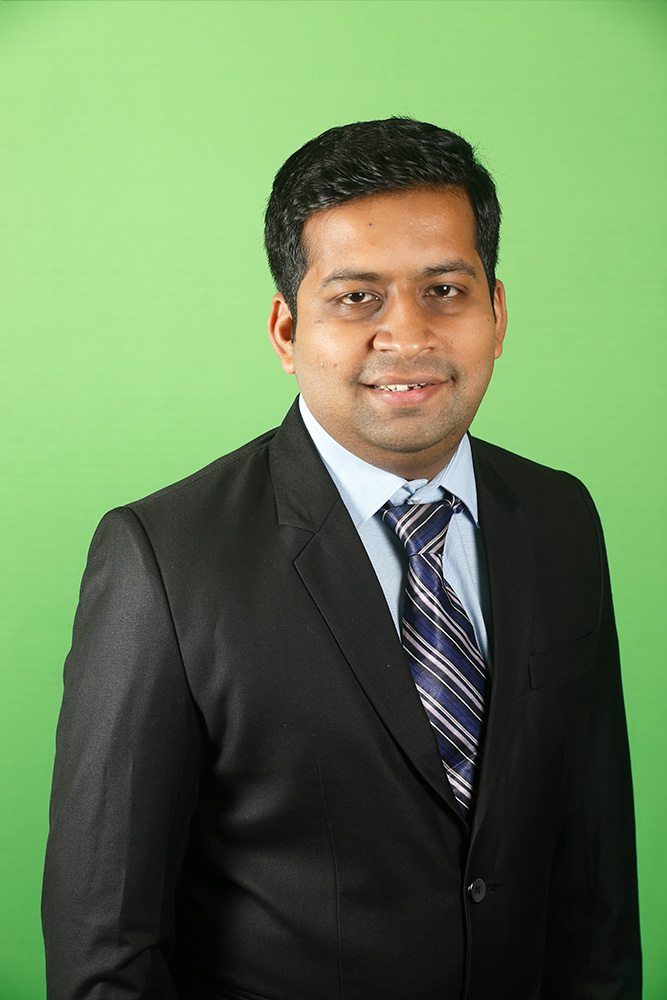 Corporate Executive in suit and  green background