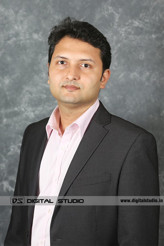 Managing Director posing on textured backdrop