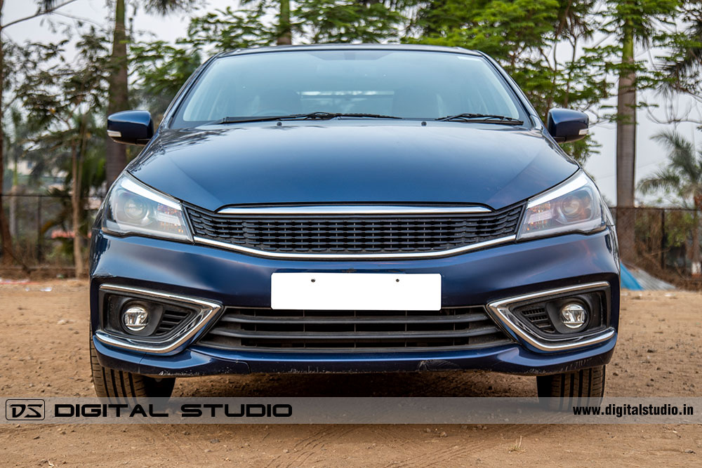 Front view of a blue sedan