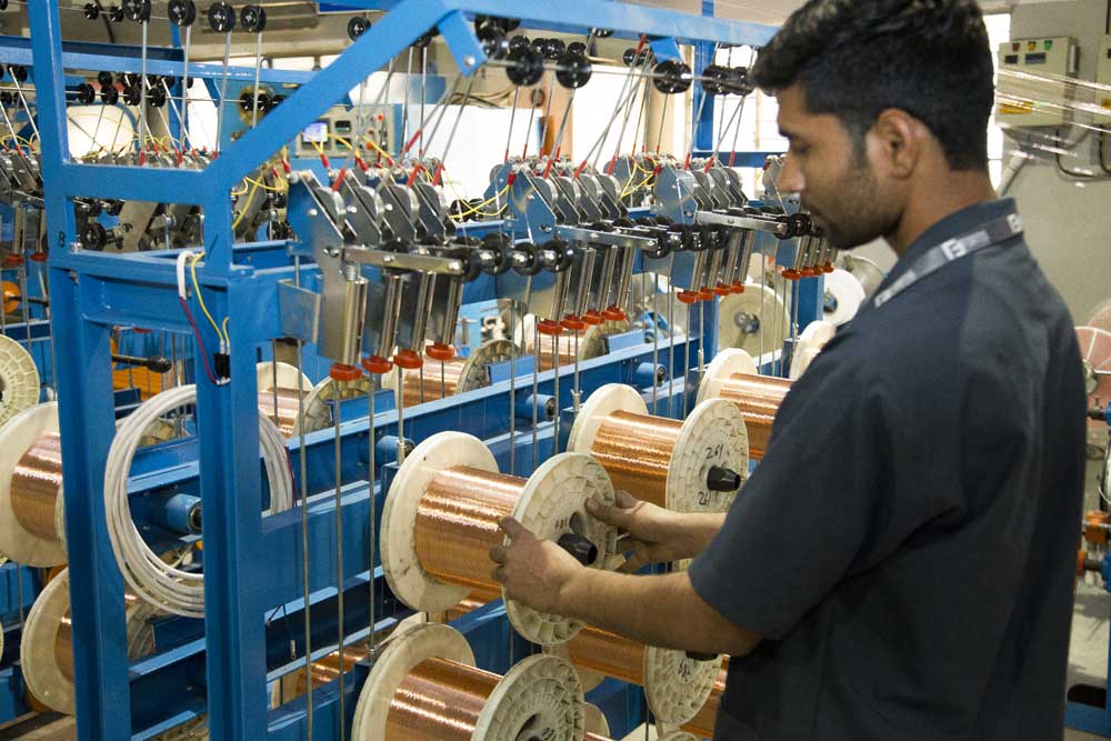 worker winding the copper wires