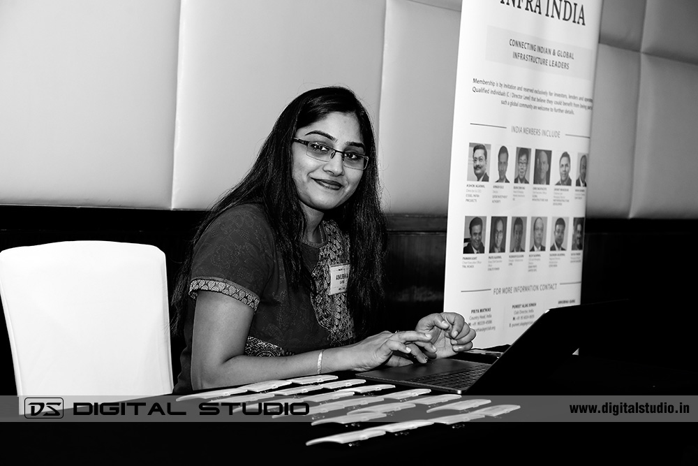 Black - white photograph of lady executive at desk