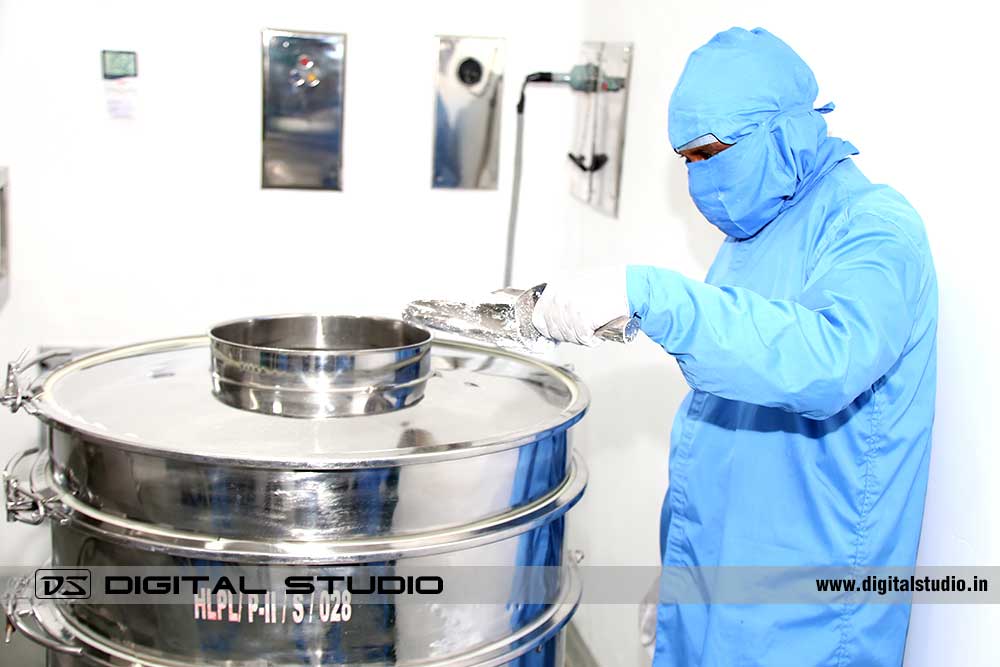 Pharma lab technician pouring chemicals