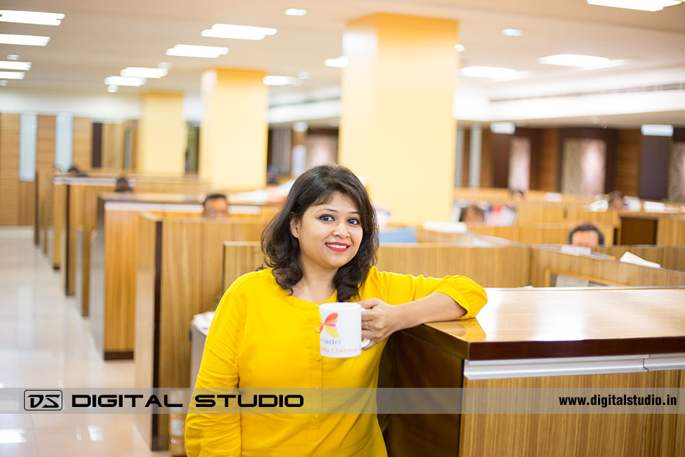 Lady executive posing with coffee mug