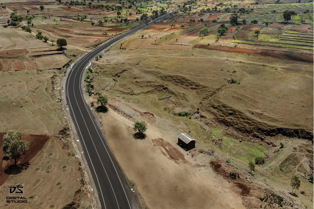 Aerial infrastructure documentation photograph of a highway alignment on the Karad Malkhapur route